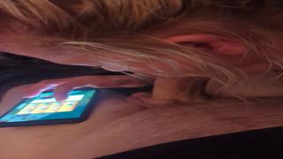 Her hubby is getting blown away while she's swiping right on her phone nearby