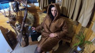 Smoking MILF blows cum-covered smoke rings, cum dripping down her sleek jacket